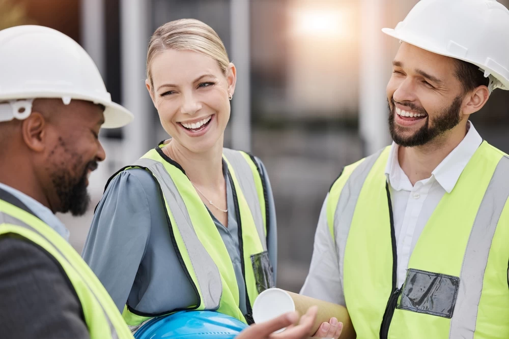 Installation team in hard hats and safety vests
